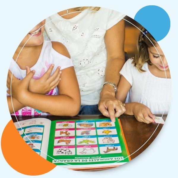 woman teaching 2 girls